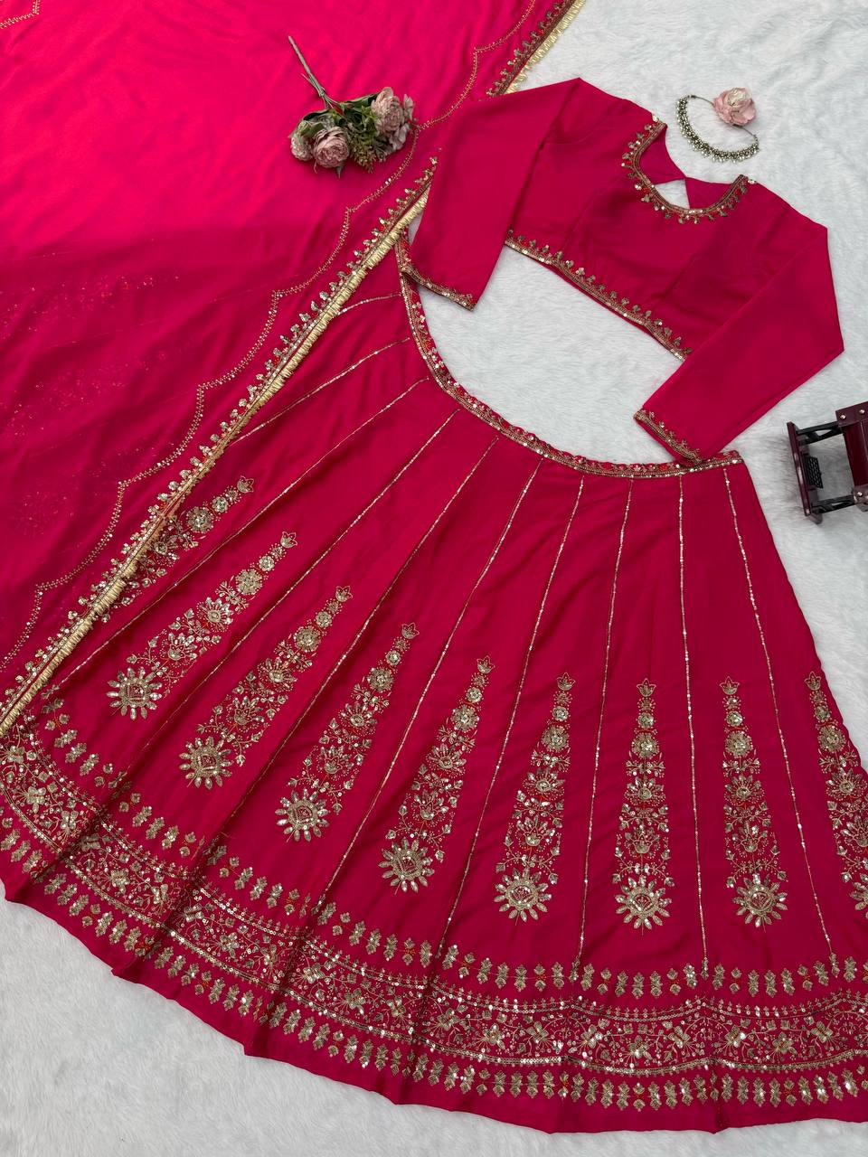 Radiant Rani Pink Silk Lehenga Choli Adorned with Opulent Heritage Floral Motifs and Intricate Zari Borders